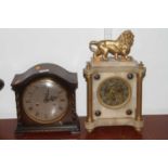 An early 20th century mantel clock, surmounted by a gilt painted lion (a/f), together with a 1930s