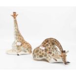 A Lomonosov porcelain figure of a giraffe, modelled seated, height 29cm, together with another