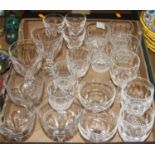 A collection of drinking glasses to include WaterfordTwo Waterford wine glasses with chips to rims.