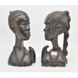 A pair of African carved hardwood head and shoulder busts, height 30cm