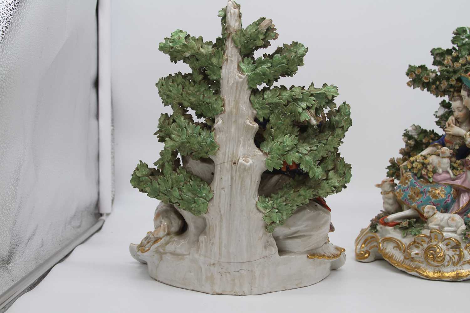 A pair of 19th century hard paste porcelain bocage figure groups, after Chelsea, each depicting a - Image 7 of 10