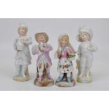 Four 20th century porcelain figures of children, largest height 18cm