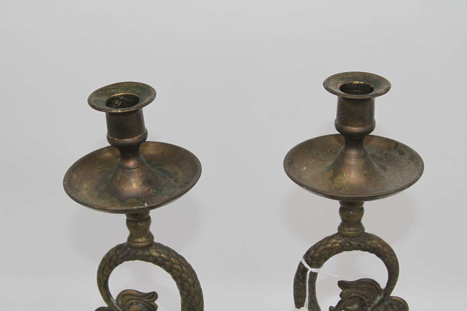 A pair of 19th century brass candlesticks, each in the form of a dolphin, mounted upon a stepped - Image 2 of 3