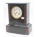 A Victorian black slate mantel clock, the enamel chapter ring showing Roman numerals, the 8 day