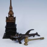 A box of miscellaneous items to include a novelty cast iron Tower Bank money box, a novelty iron