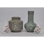 A Korean green glazed octagonal vase, height 15cm, together with another similar, and a pair of