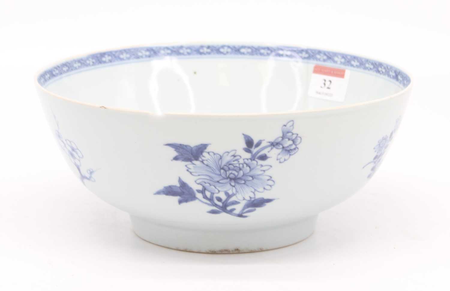 An 18th century Chinese blue and white porcelain bowl, decorated with flowers, dia. 24cm (a/f)