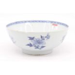 An 18th century Chinese blue and white porcelain bowl, decorated with flowers, dia. 24cm (a/f)