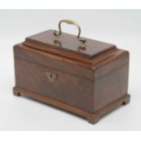 A George III mahogany and barber pole strung triple compartment tea caddy, the cavetto moulded lid