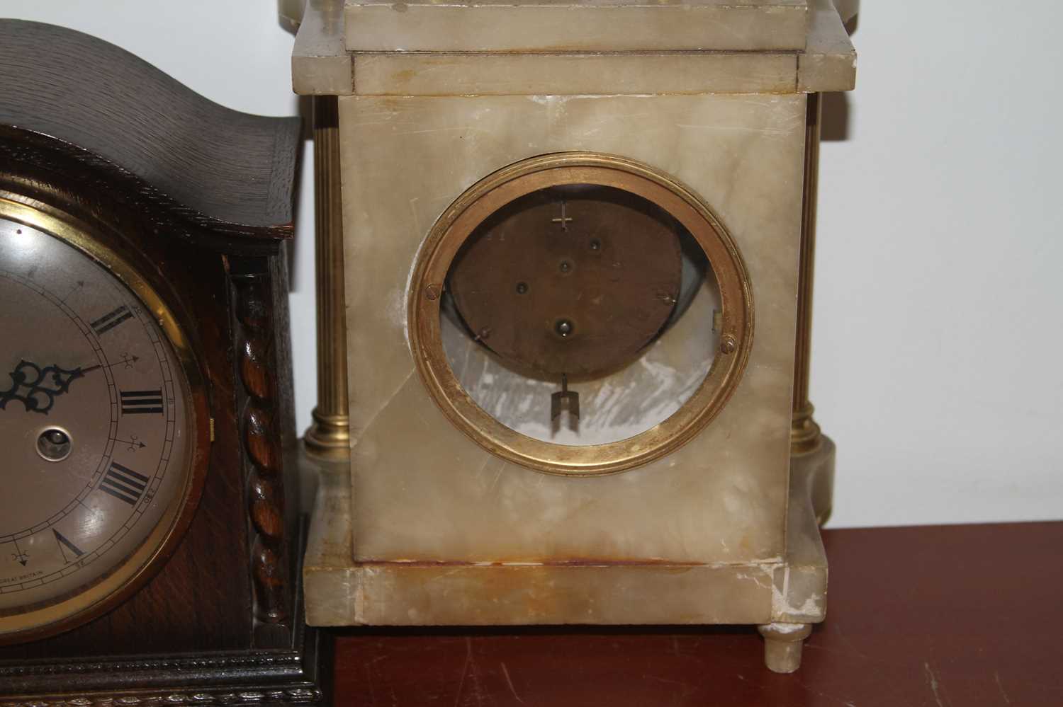 An early 20th century mantel clock, surmounted by a gilt painted lion (a/f), together with a 1930s - Image 2 of 2