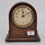 An early 20th century mahogany cased mantel clock, standing upon four brass ball feet, height 18cm