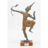 A Thai verdigris metal figure of an archer, mounted upon a hardwood plinth, height 32cm