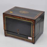 A 19th century ebonised rosewood and brass banded box with fitted interior, on bracket feet, width