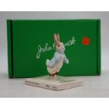 A John Beswick Beatrix Potter figure 'Peter on his book', h.12cm, boxed