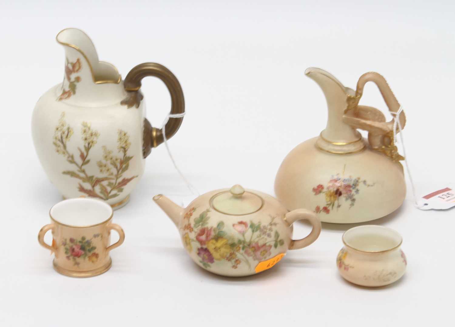 A Royal Worcester Old Ivory cleft jug, h.13cm; together with four Royal Worcester blush ivory