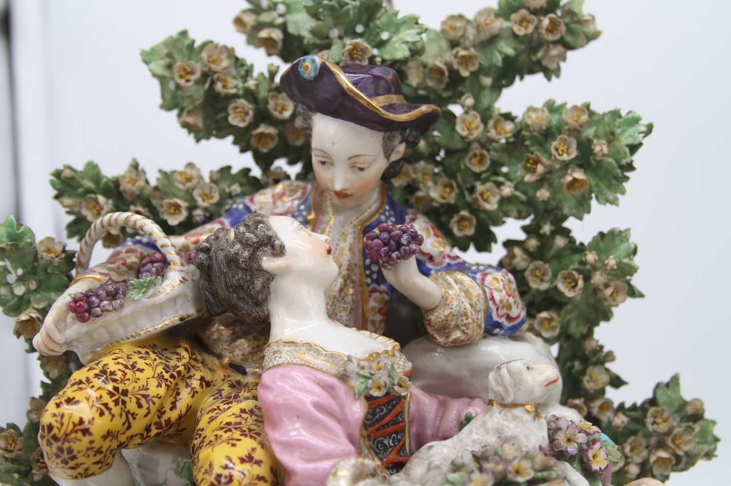A pair of 19th century hard paste porcelain bocage figure groups, after Chelsea, each depicting a - Image 5 of 10