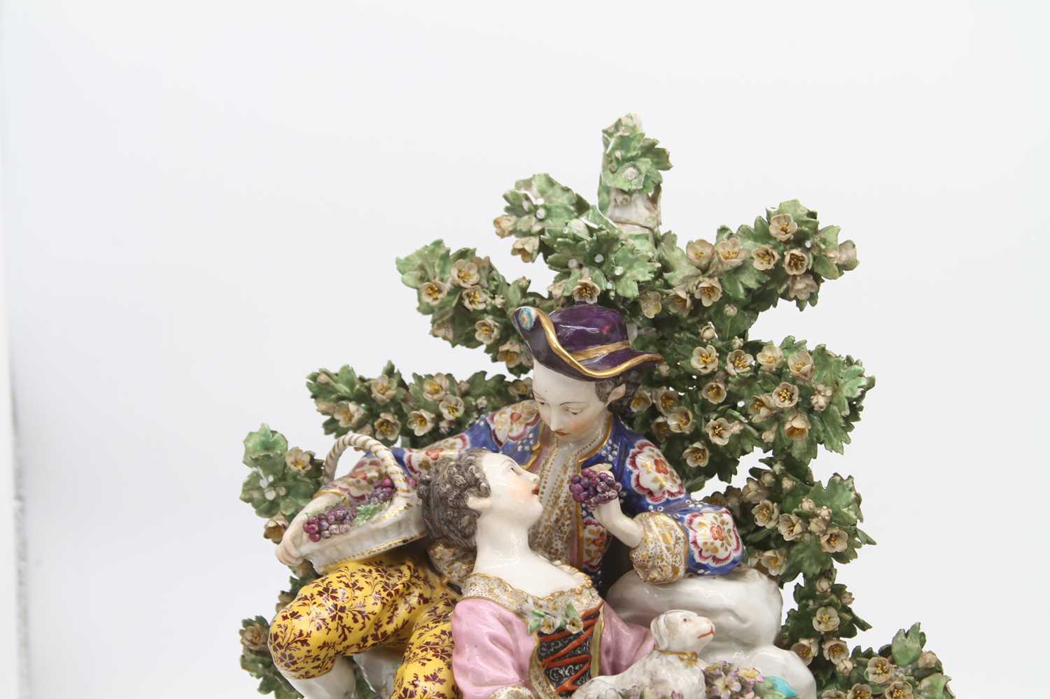 A pair of 19th century hard paste porcelain bocage figure groups, after Chelsea, each depicting a - Image 2 of 10