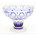 A blue overlaid crystal bowl, having star and diamond cut decoration, height 18cm