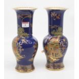 A pair of Carlton ware blue lustre vases, each of baluster form, gilt and enamel decorated with a