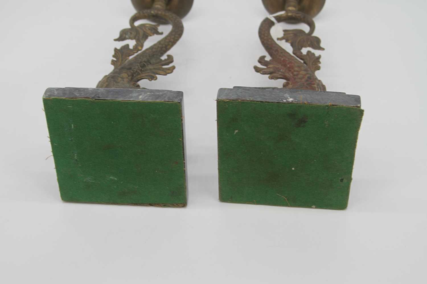 A pair of 19th century brass candlesticks, each in the form of a dolphin, mounted upon a stepped - Image 3 of 3