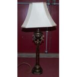 A modern gilt table lamp, having a cream shade, height 85cm