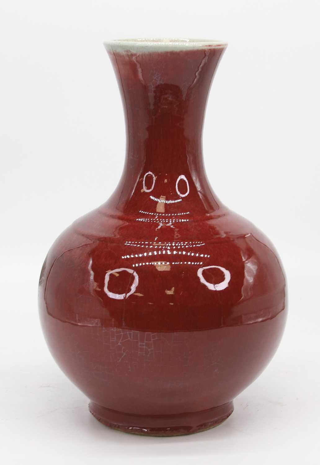 A Chinese Sang de Boef vase, of baluster form, apocryphal Yongzheng reign mark to the underside,
