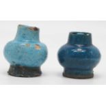 A near pair of turquoise glazed vases, each of squat globular form, height of largest 6.5cm (a/f)