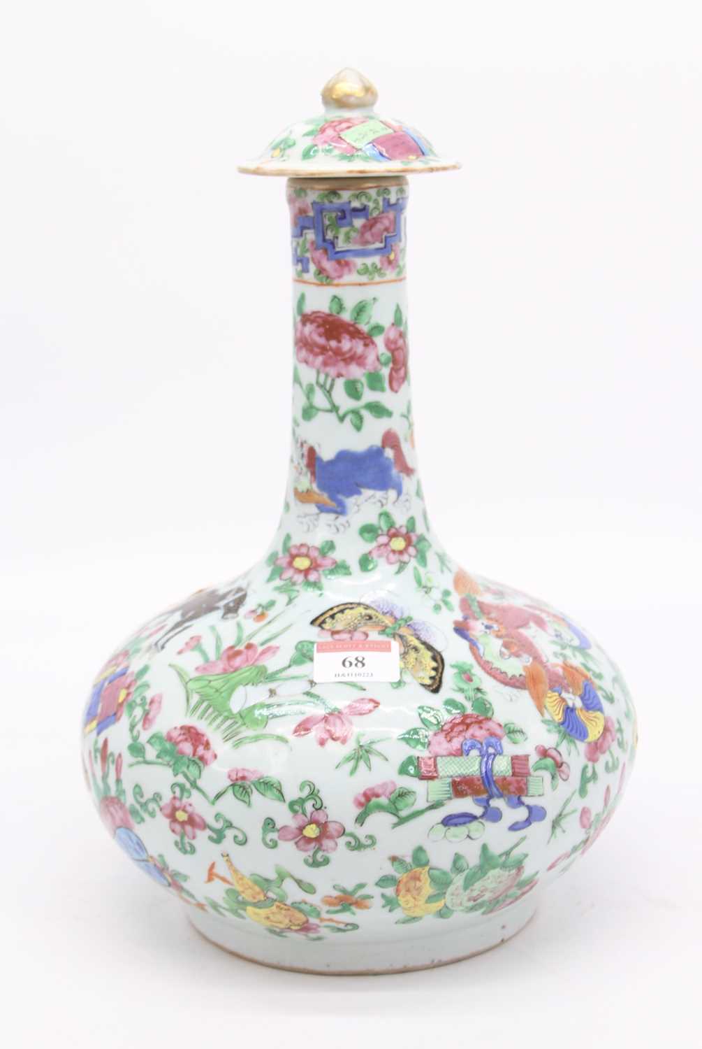 A 19th century Chinese Canton porcelain bottle vase and cover, enamel decorated with dragons and