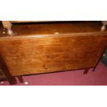 An early 19th century mahogany dropleaf dining table