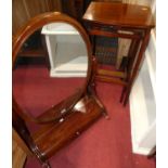 A large Victorian mahogany oval swing dressing mirror, with hinged lower compartment, w.59cm;