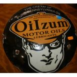 An enamelled metal convex circular wall sign for Oilzum Motor Oils Lubricants, dia.29.5cm