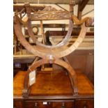 A circa 1900 Spanish relief carved walnut X-framed elbow chair, w.57cm