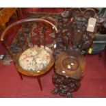 A 19th century Italian heavily carved walnut hall chair, carved with grotesque mask and caryatid