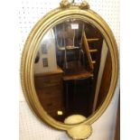 A Victorian later giltwood decorated oval wall mirror, 76 x 54cmThe mirror has been damaged to the