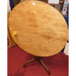 A 19th century oak and fruitwood circular tilt-top tripod table, dia.83.5cmAge related marks. Has