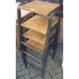 A set of four mid-20th century tubular metal and plywood stacking stools