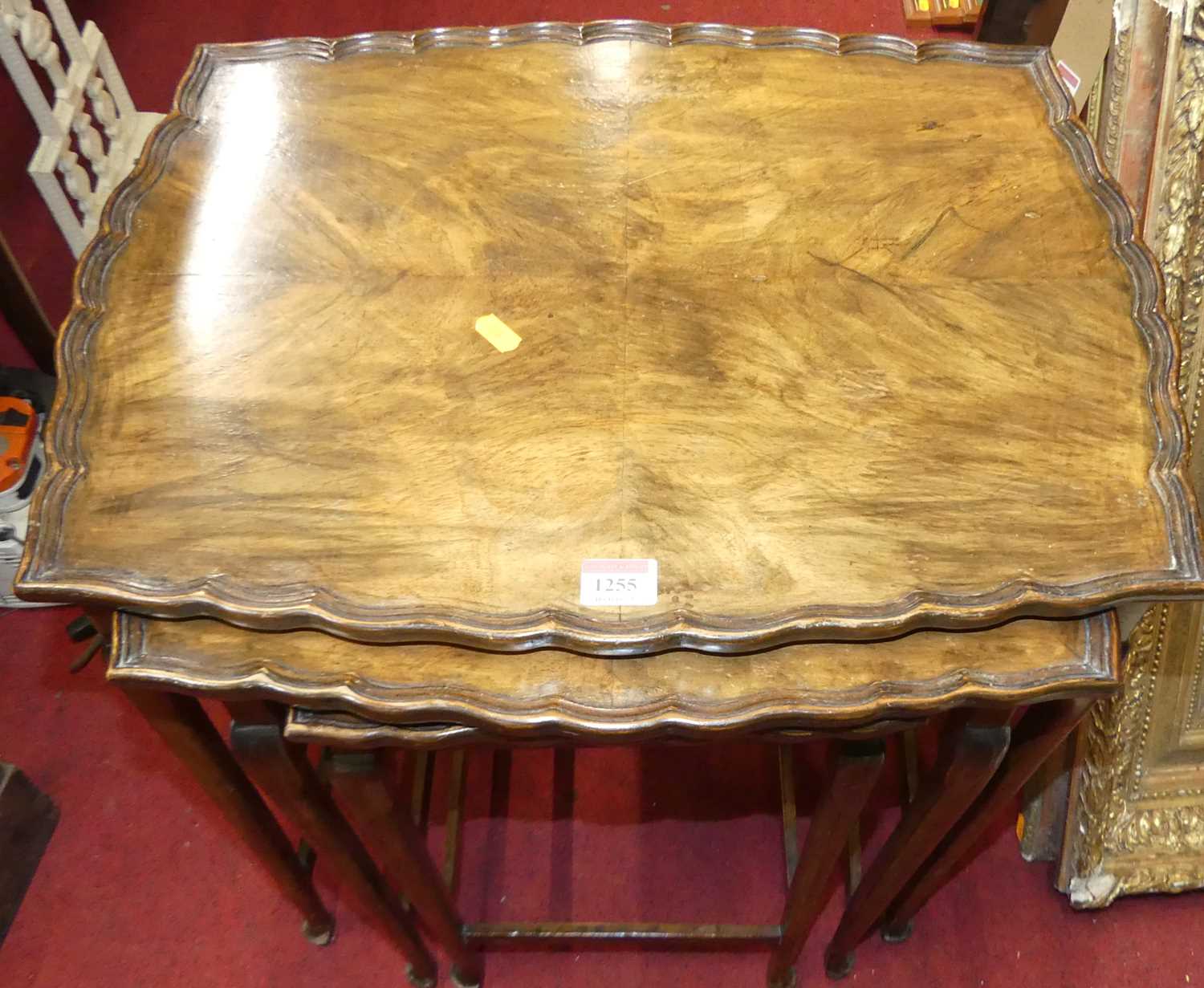 A walnut nest of three occasional tables, the largest w.53cm