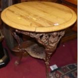 A good pierced cast iron based and circular pine marble topped pub table by T. Green & Son Ltd of