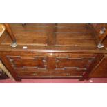 An 18th century and later geometric twin panelled joined oak hinge topped mule chest, with single