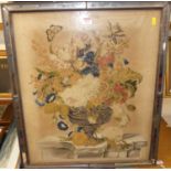 A Victorian needlework featuring a posy of flowers on a stone ledge, 60x51cm, and housed in mirror
