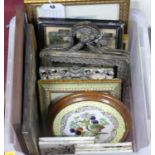 A box of assorted prints, frames, and earthenware tiles, etc