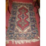 A Persian woollen blue ground Shiraz rug, with flattened Kelim ends, 195 x 122cm