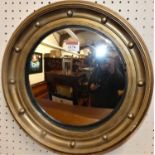 A Regency style gilt framed convex circular wall mirror, dia.35cm