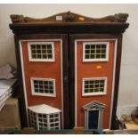 A vintage scratch built Victorian style dolls house with furnishings and an additional box of