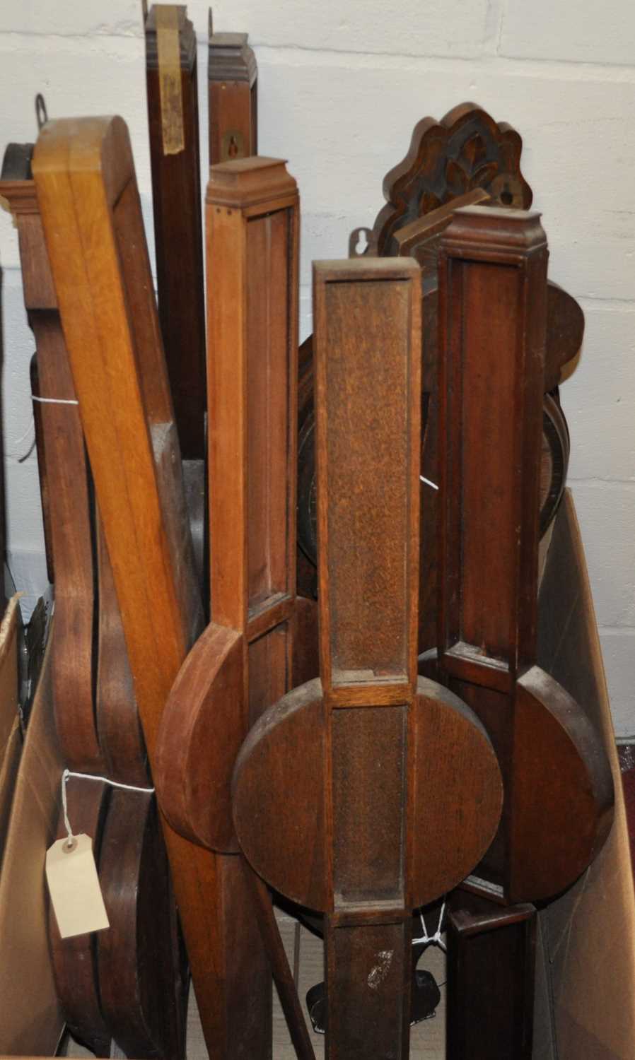 Assorted wheel barometer cases, to include oak demonstration models, four carved cases for aneroid