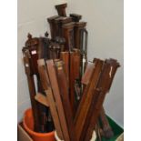 A selection of stick barometers, largely in mahogany, to include ropetwist examples, with reeded