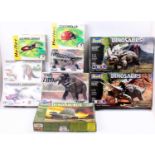 A collection of 9 various boxed dinosaur related plastic kits to include Revell, Tamiya, Heller