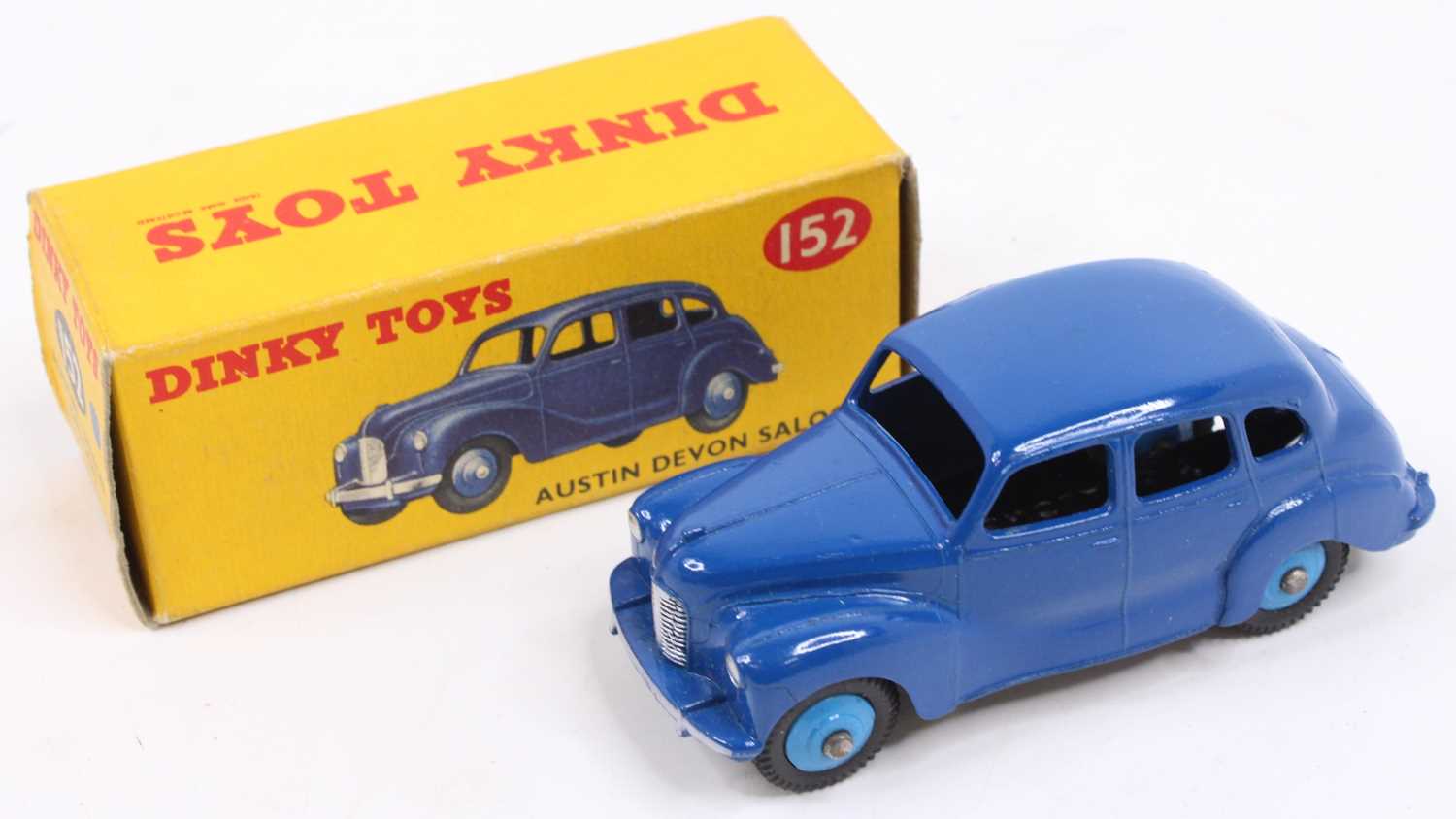 Dinky Toys No. 152 Austin Devon Saloon, with a dark blue body, light blue ridged hubs, tinplate