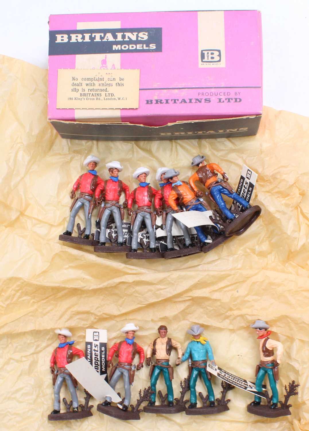 A Britains Swoppets No. 656 Cowboy Gun Fighter trade box containing 11 of 12 examples, all in good