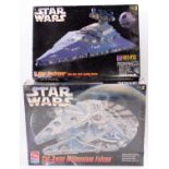 A Star Wars AMT/ERTL boxed plastic kit group, to include a Cutaway Millennium Falcon, housed in